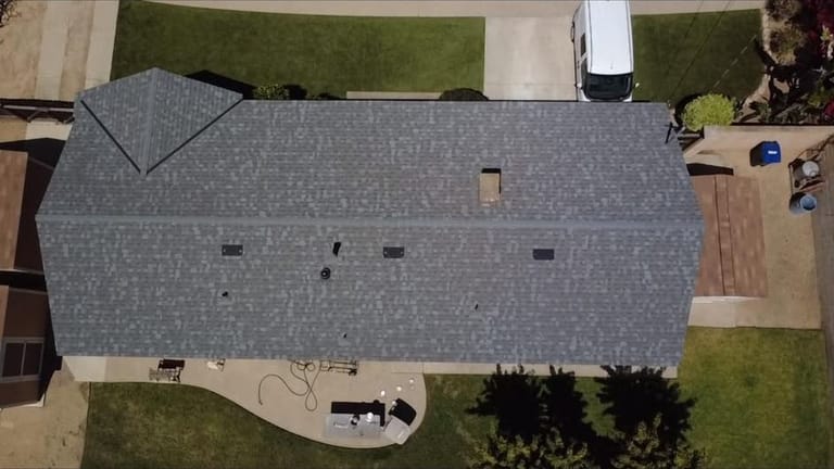 Completed gray architectural shingle roof, aerial view