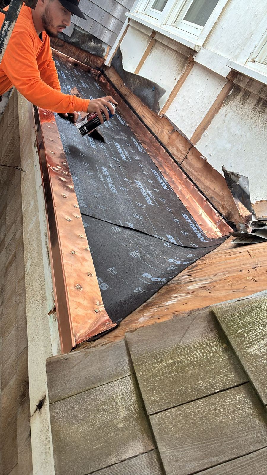 Craftsman installing copper valley flashing