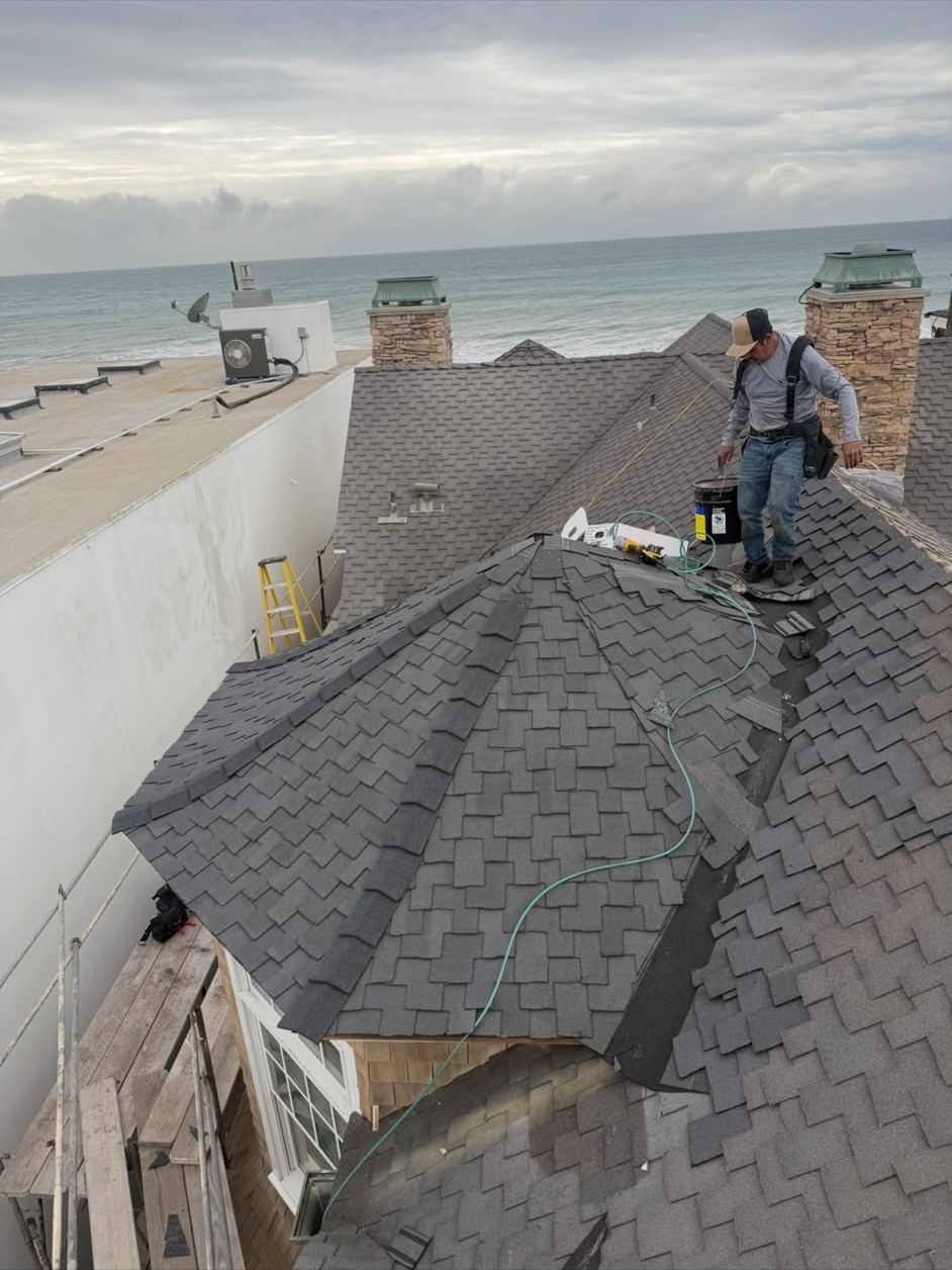 CaliPeak roofer inspecting a coastal shingle roof
